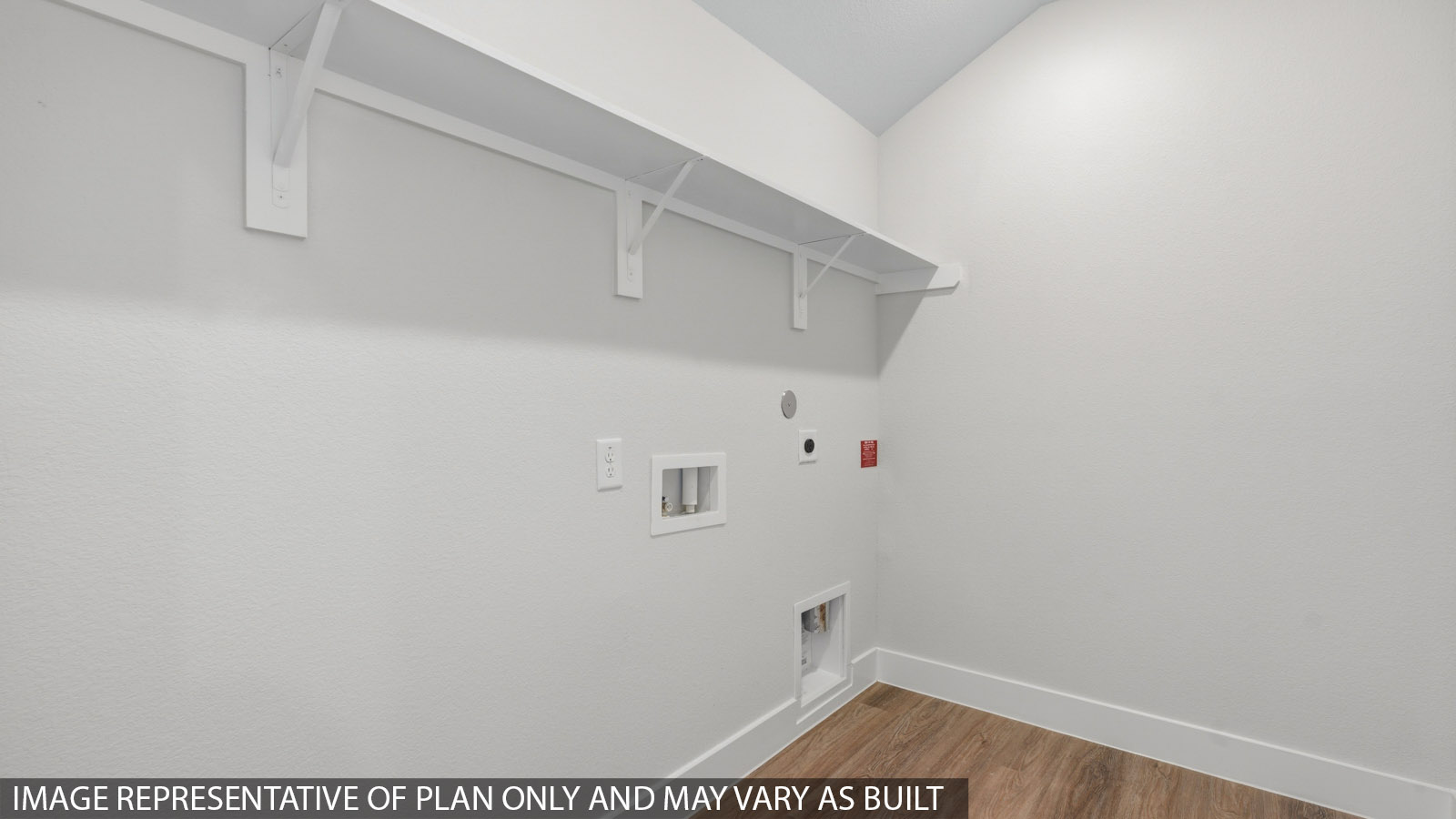 Utility room with storage located off the entry hallway and garage door