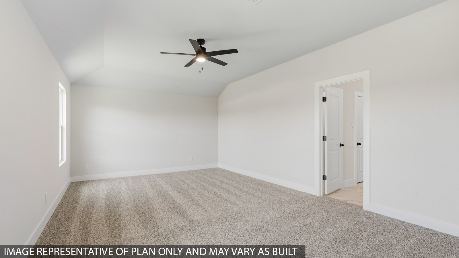 Large Primary bedroom with shag carpet flooring and bright window