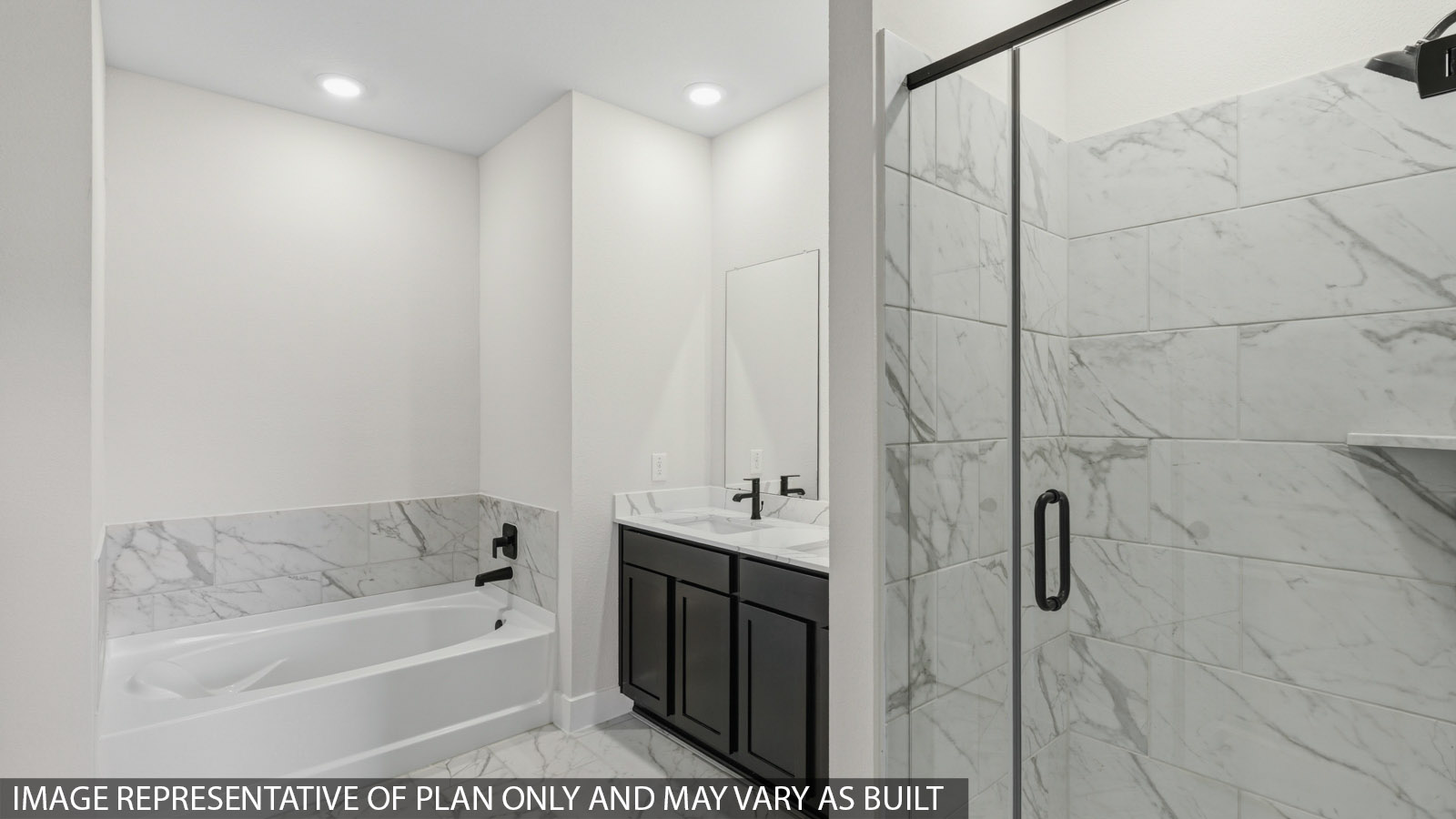 Primary bathroom with soaker tub and tile shower with semi frameless glass in Montgomery TX
