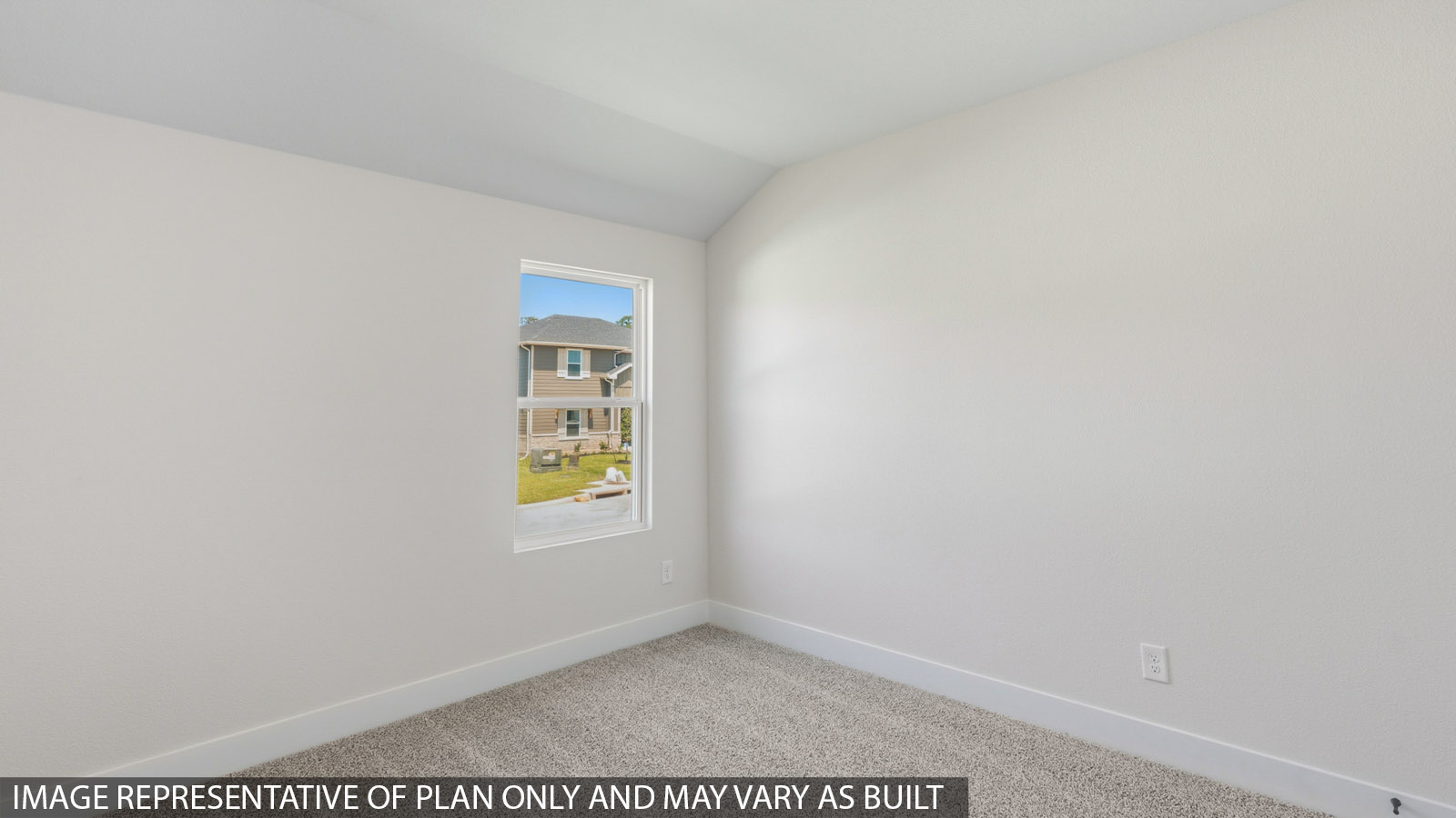 Secondary bedroom with shag carpet flooring and bright window