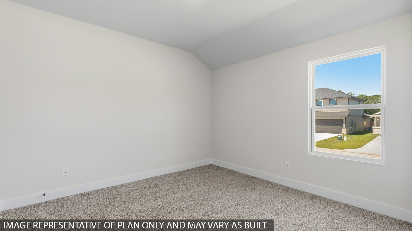 Secondary bedroom with shag carpet flooring and bright window