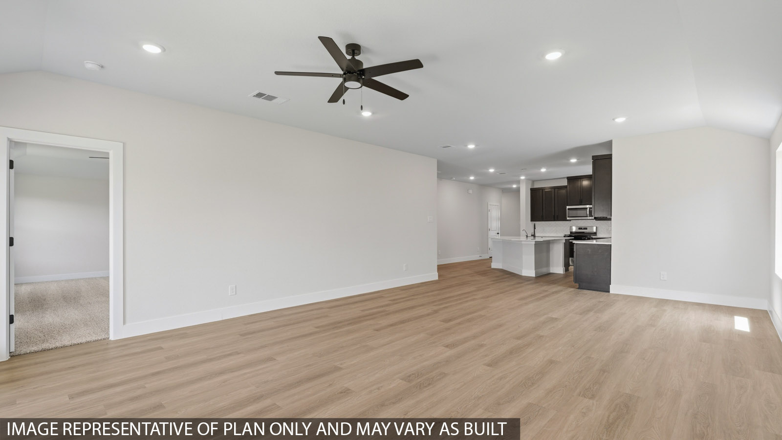 Spacious living area with vinyl flooring and bright windows in Montgomery TX