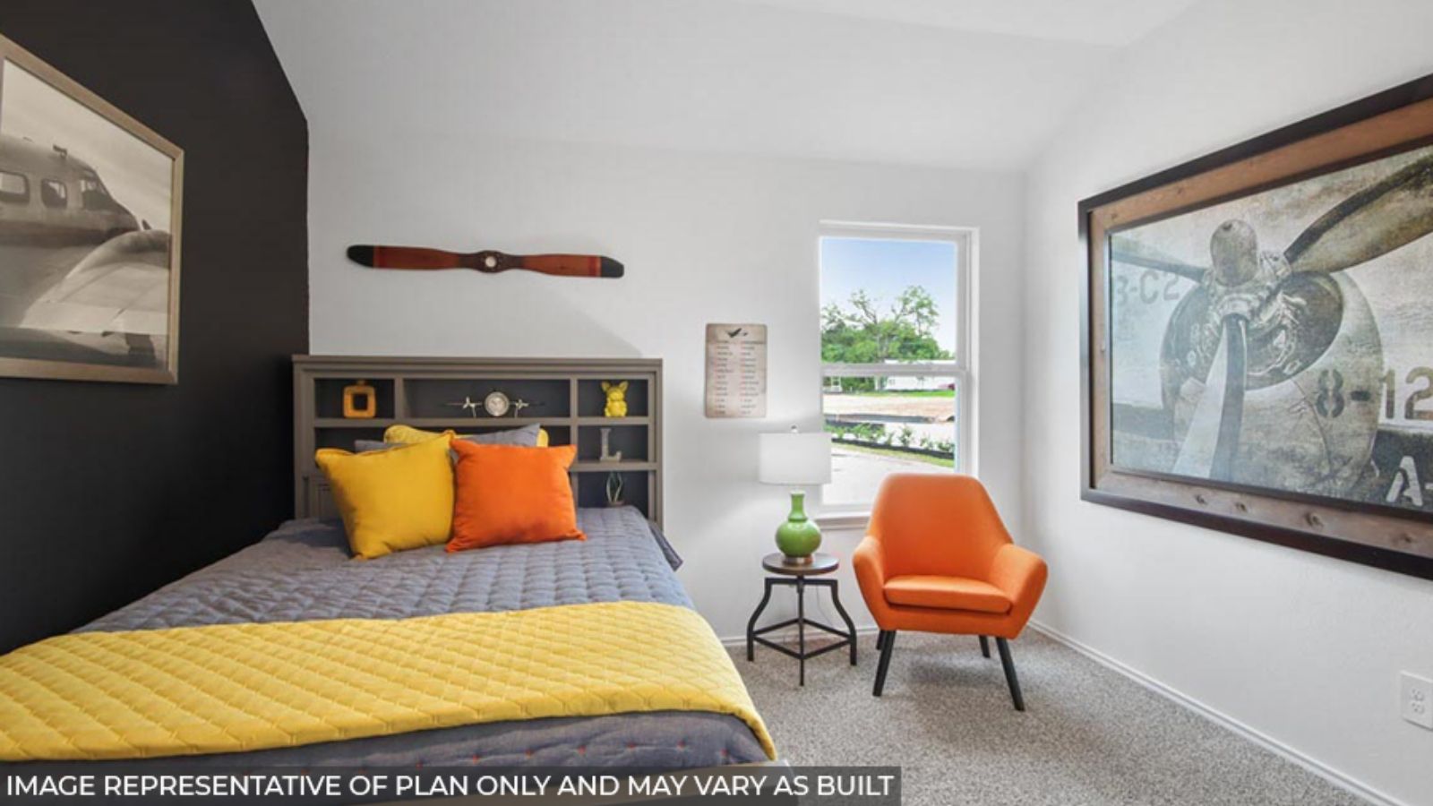 Secondary bedroom with shag carpet flooring and bright window