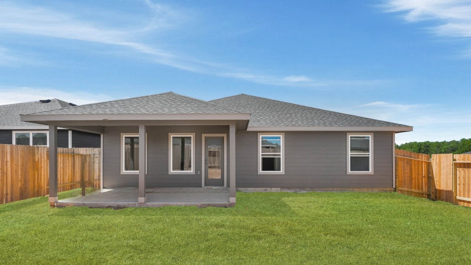 covered patio with jamies hardie siding and overhead lighting