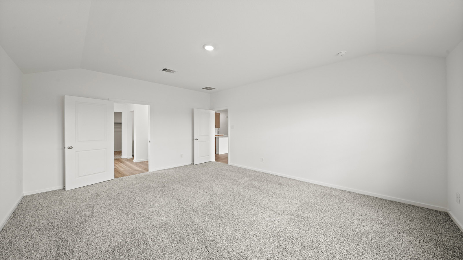 Primary bedroom with carpet flooring