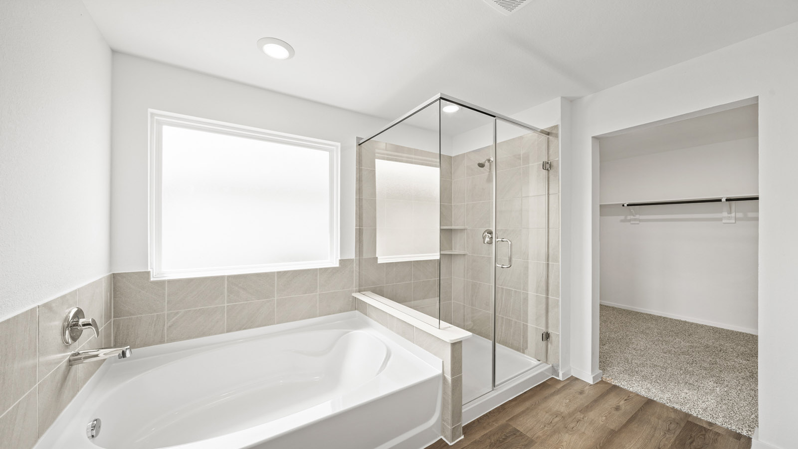 Primary bathroom with tub and shower