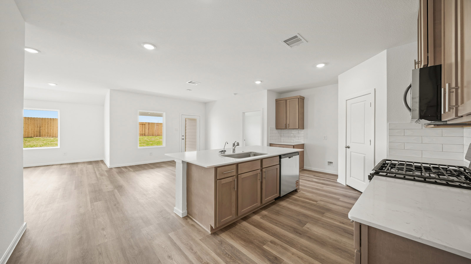 Kitchen with an island and vinyl floor