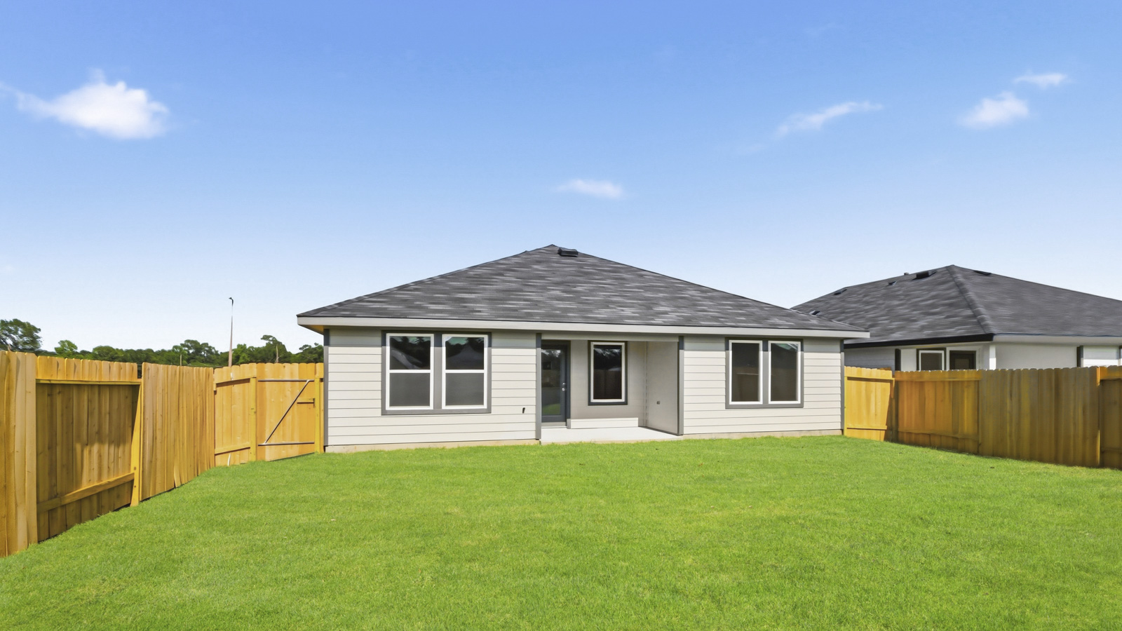 covered patio with jamies hardie siding and overhead lighting
