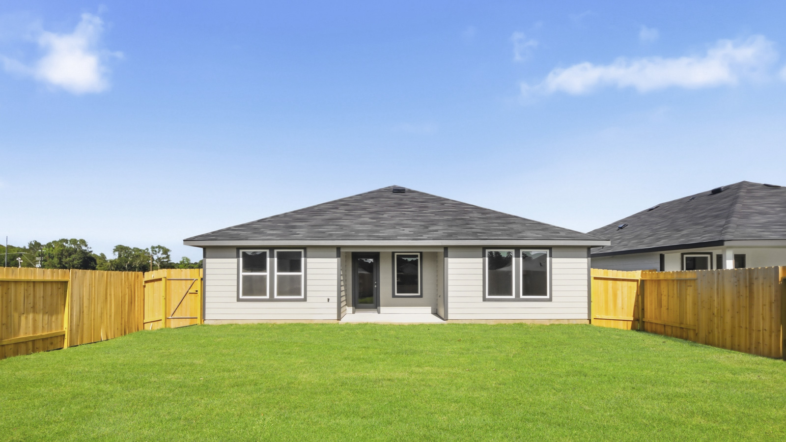covered patio with jamies hardie siding and overhead lighting