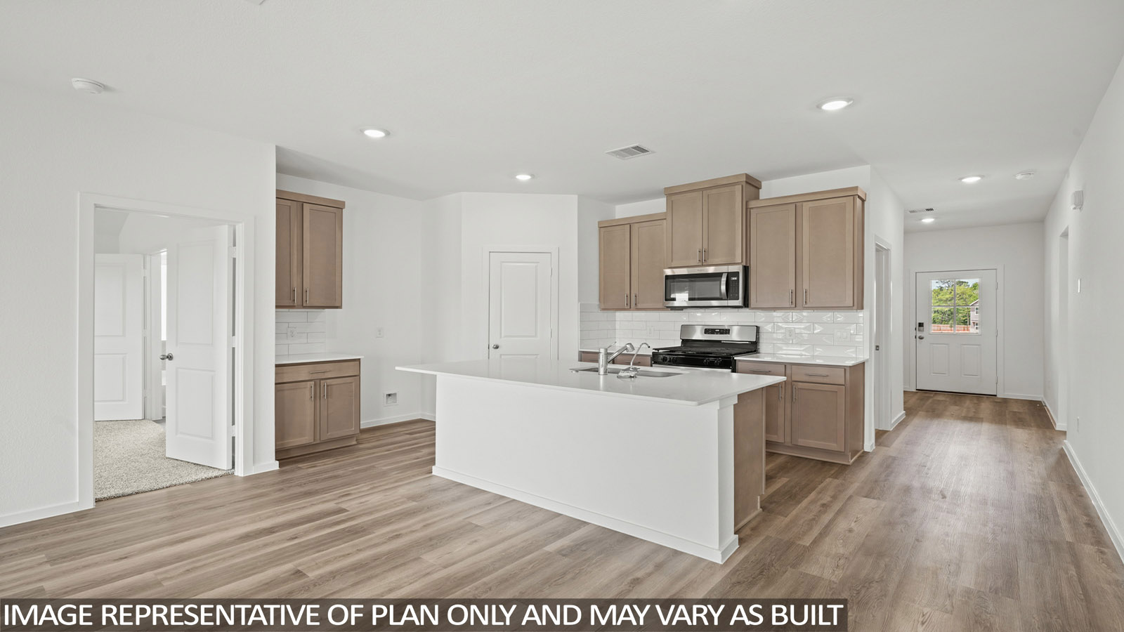 Kitchen with an island and vinyl floor