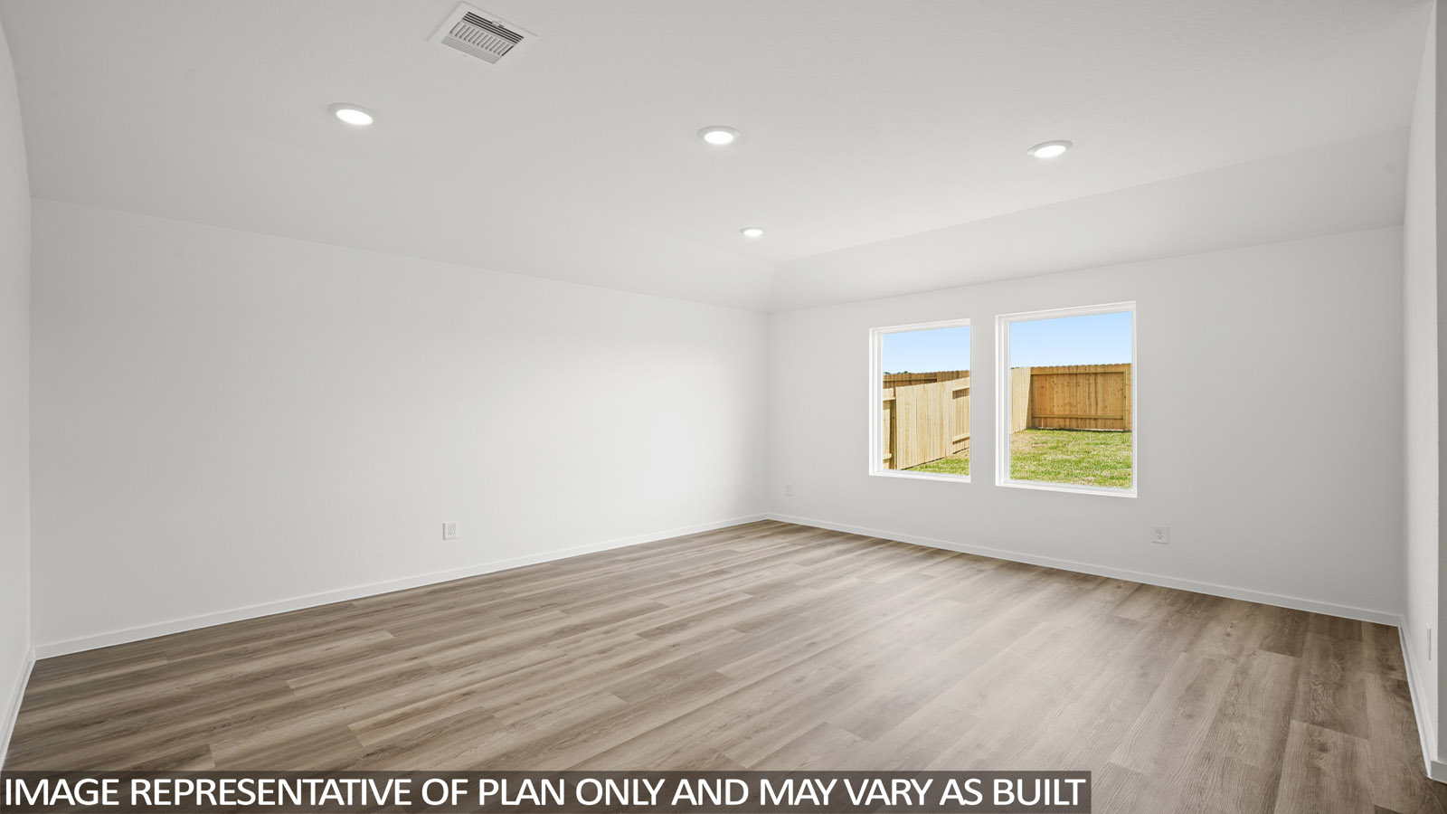 Spacious living area with vinyl flooring