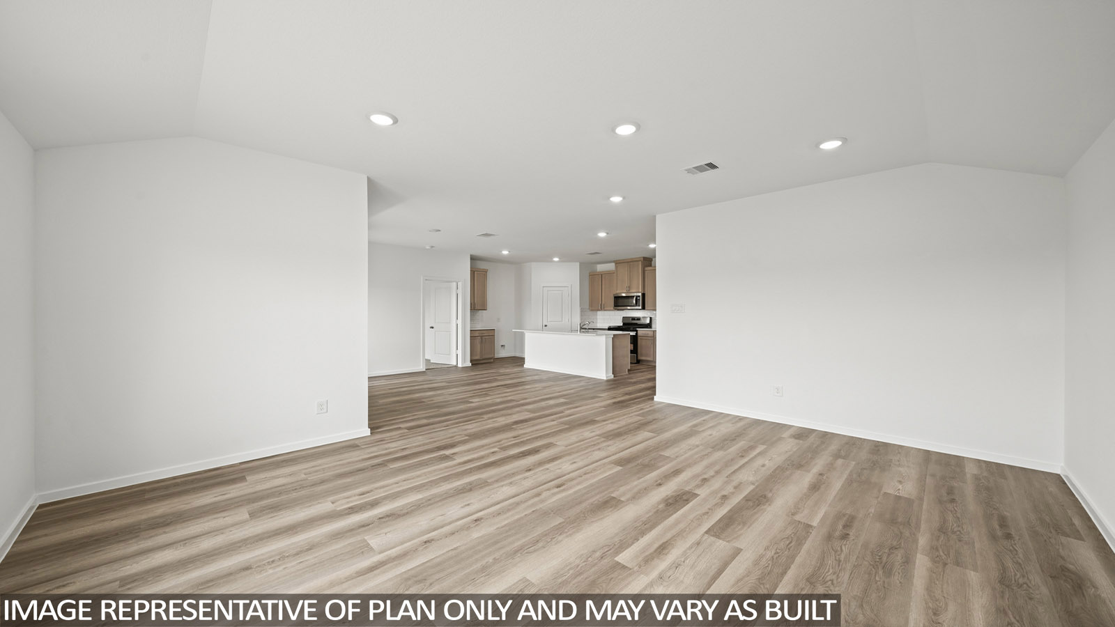 Spacious living area with vinyl flooring