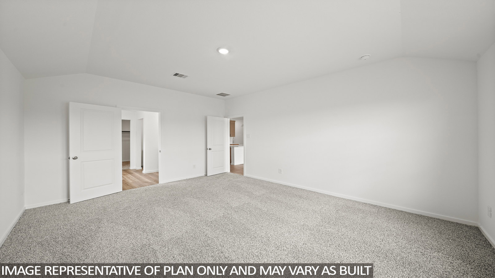 Primary bedroom with carpet flooring