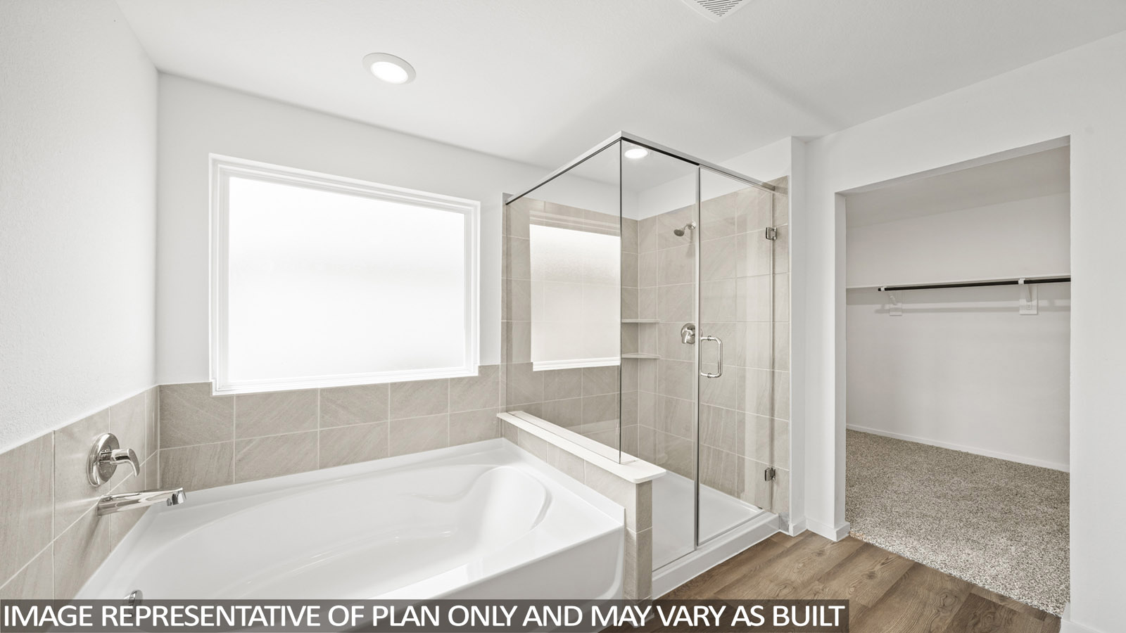 Primary bathroom with tub and shower