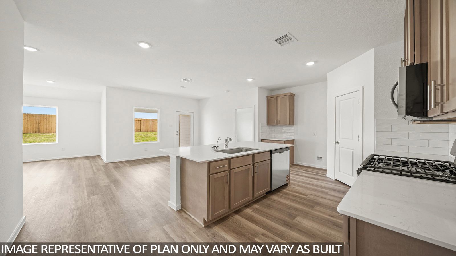 Kitchen with an island and vinyl floor