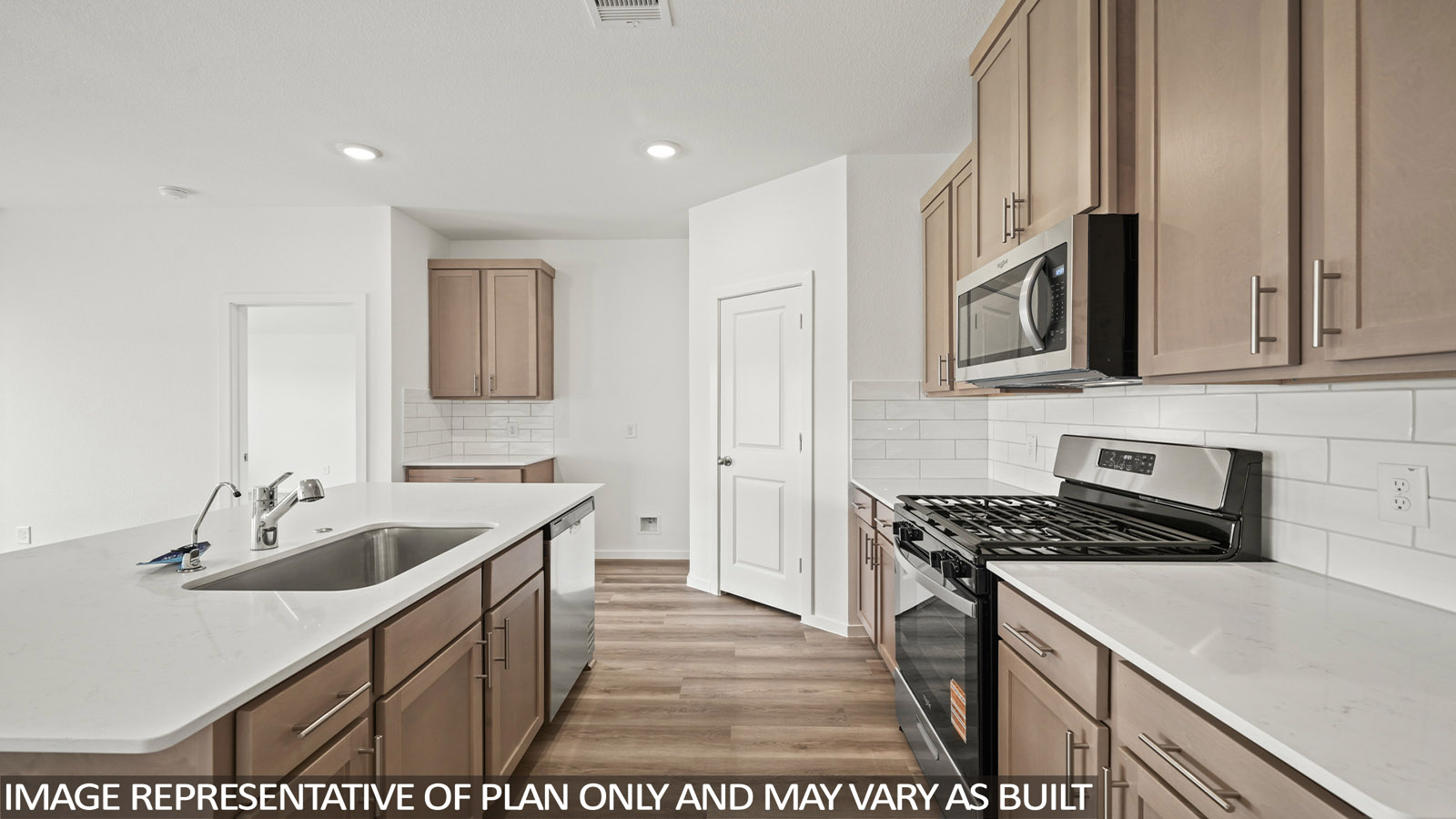 Kitchen with an island and vinyl floor