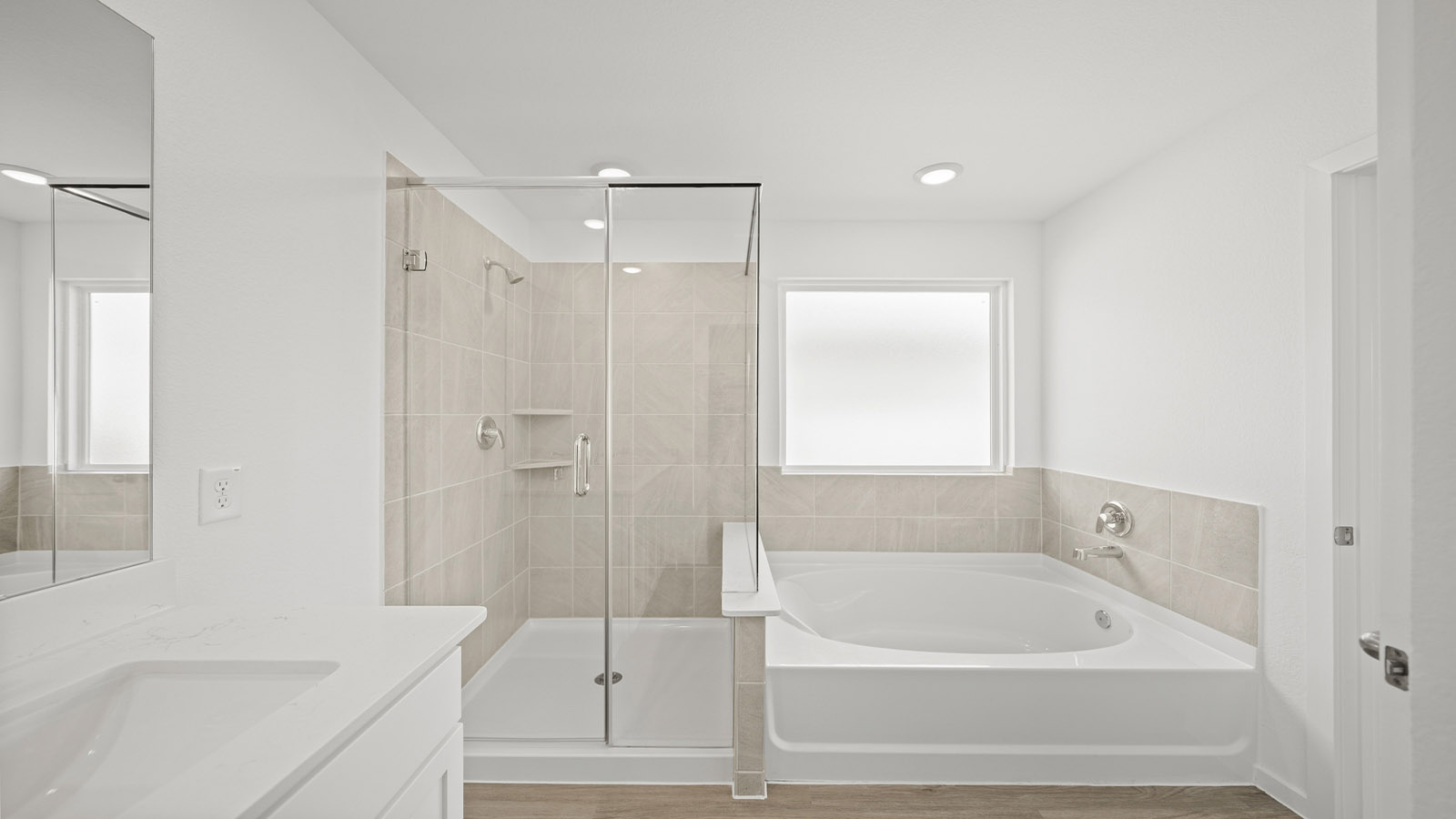 Primary bathroom with tub and shower