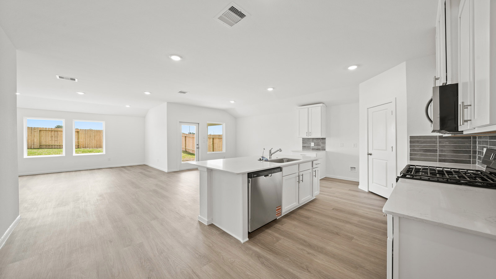 Kitchen with an island and vinyl floor