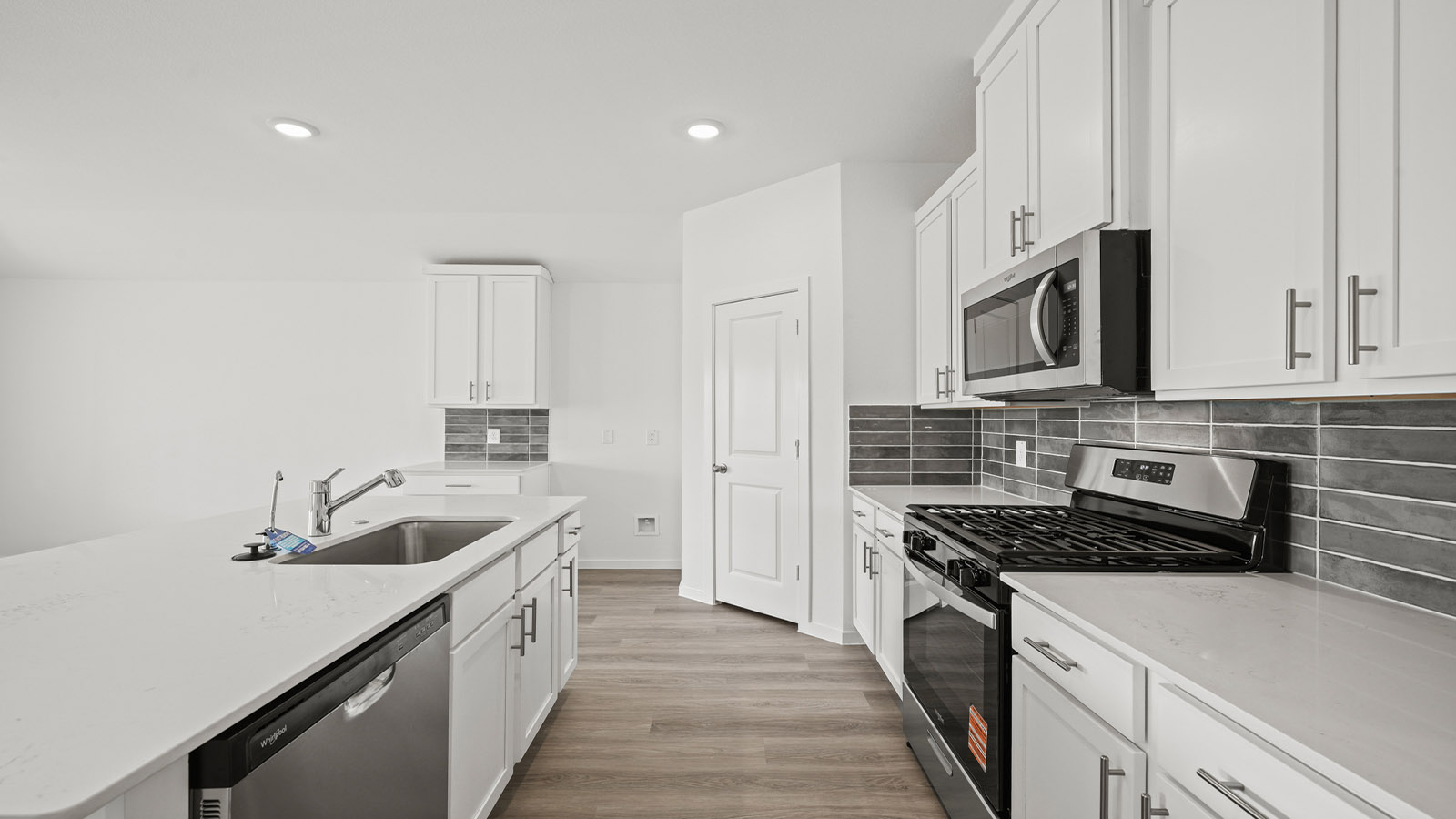 Kitchen with an island and vinyl floor