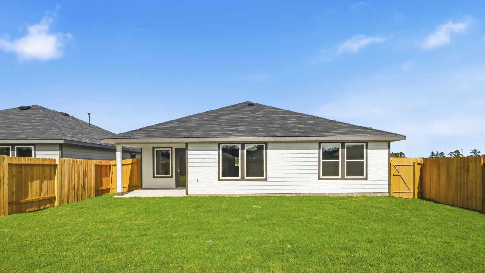 covered patio with jamies hardie siding and overhead lighting