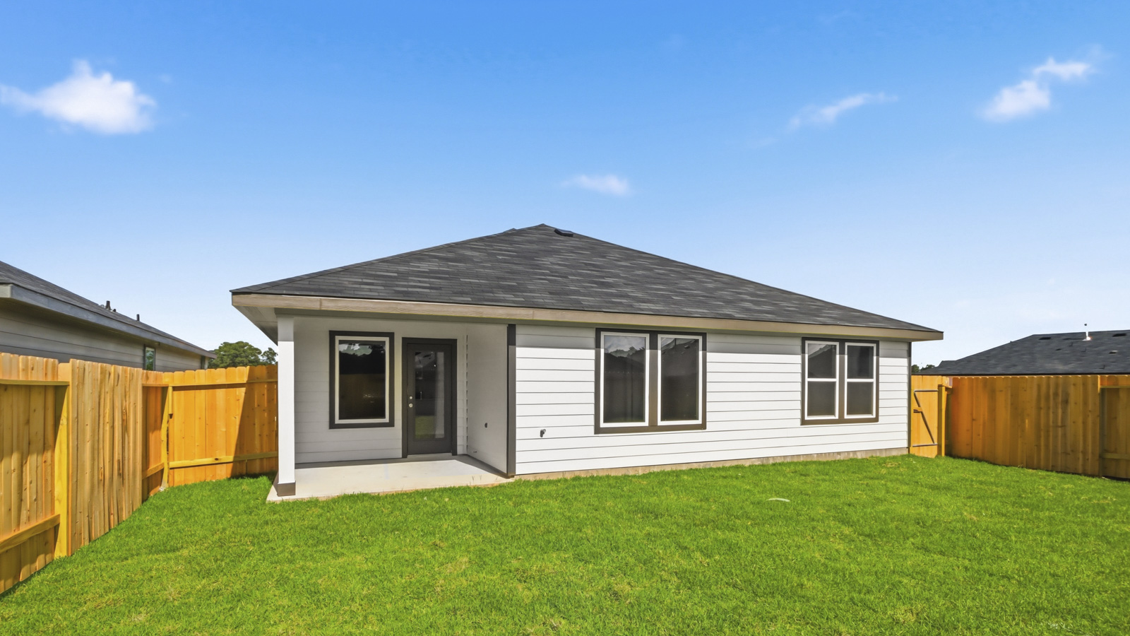 covered patio with jamies hardie siding and overhead lighting
