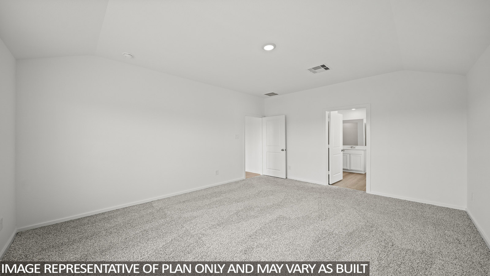 Primary bedroom with carpet flooring