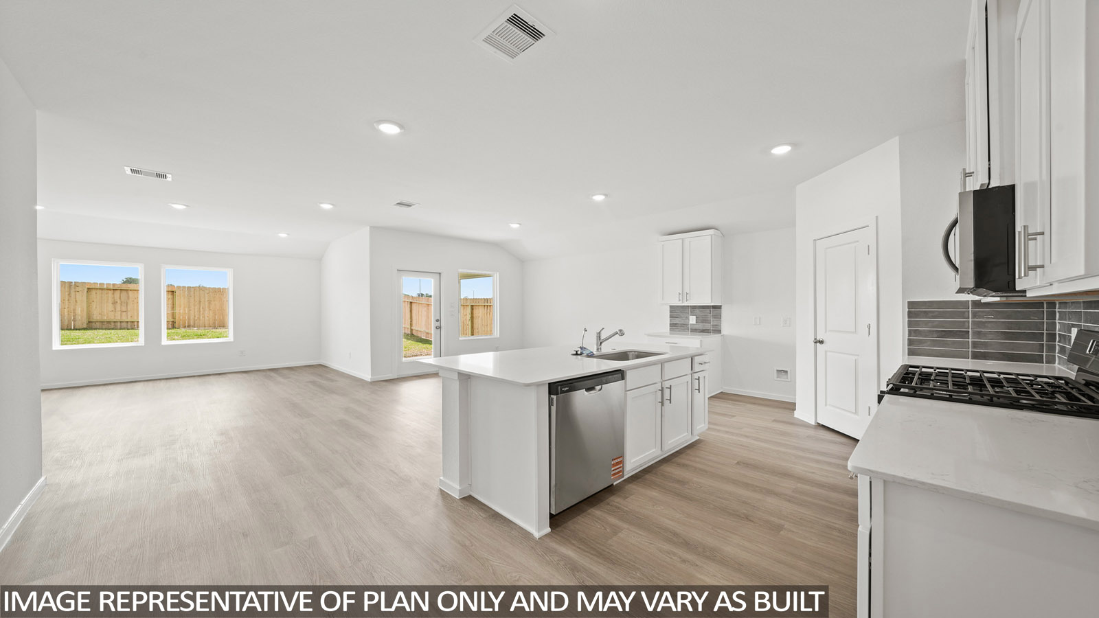 Kitchen with an island and vinyl floor