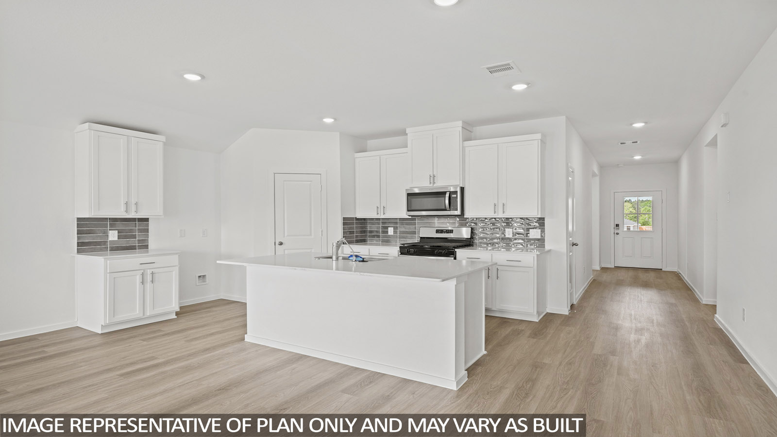 Kitchen with an island and vinyl floor
