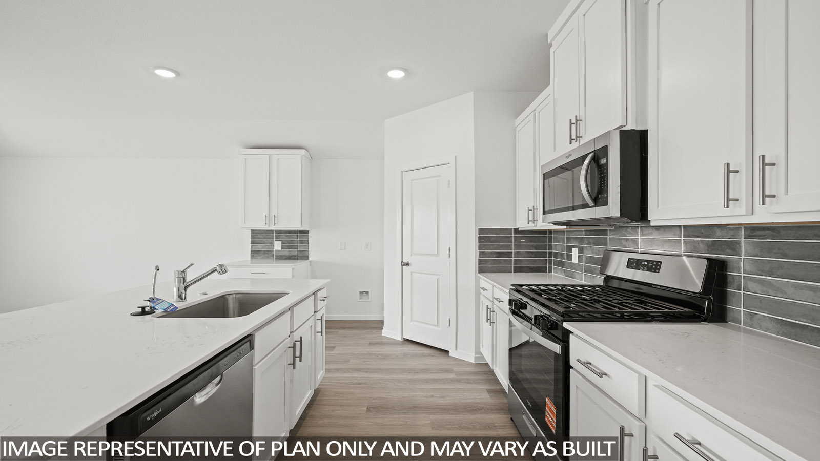 Kitchen with an island and vinyl floor