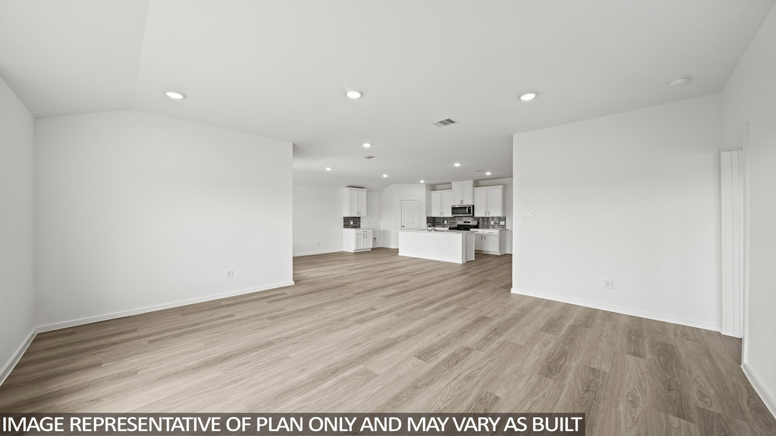 Spacious living area with vinyl flooring