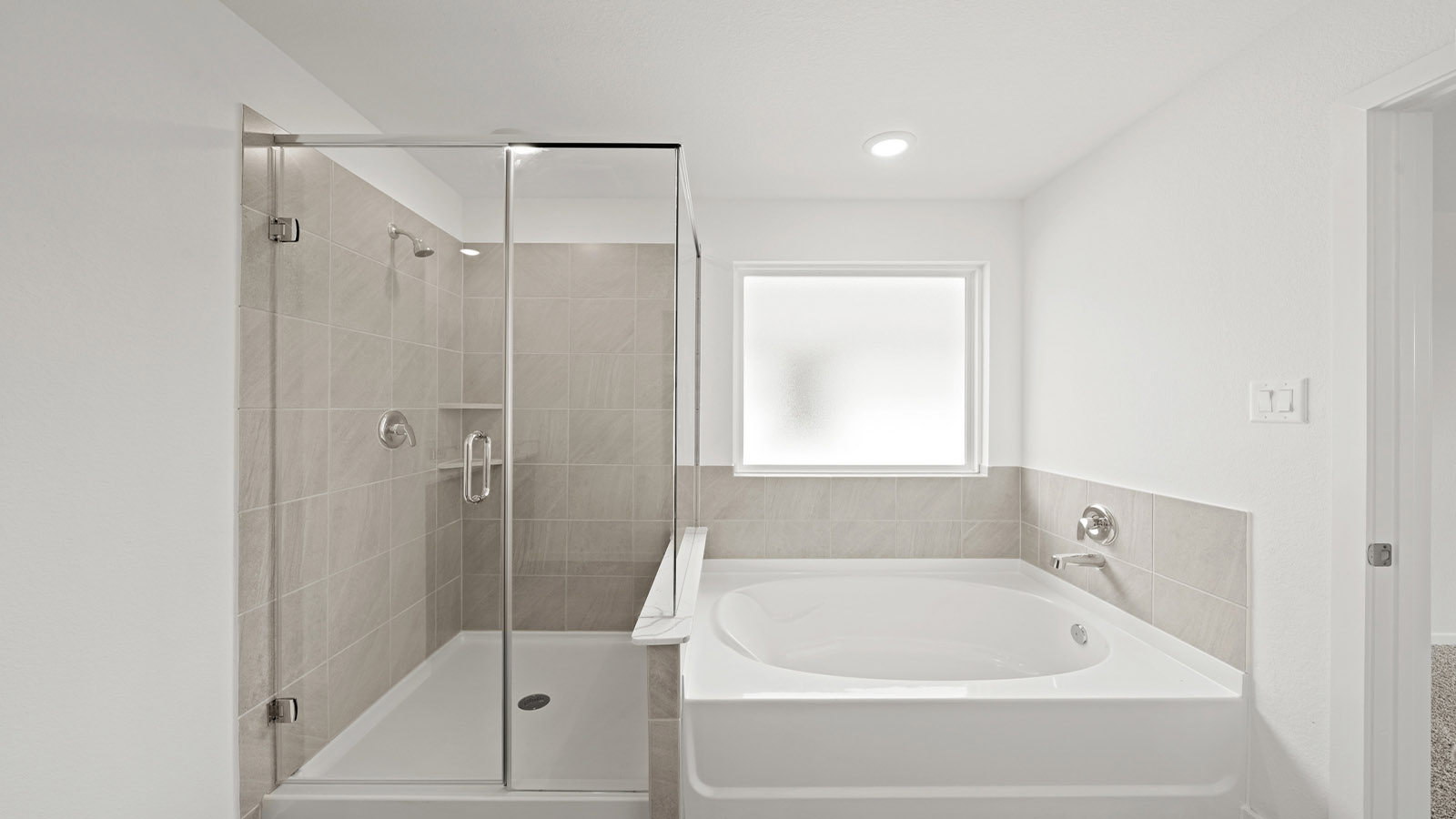 Primary bathroom with tub and shower