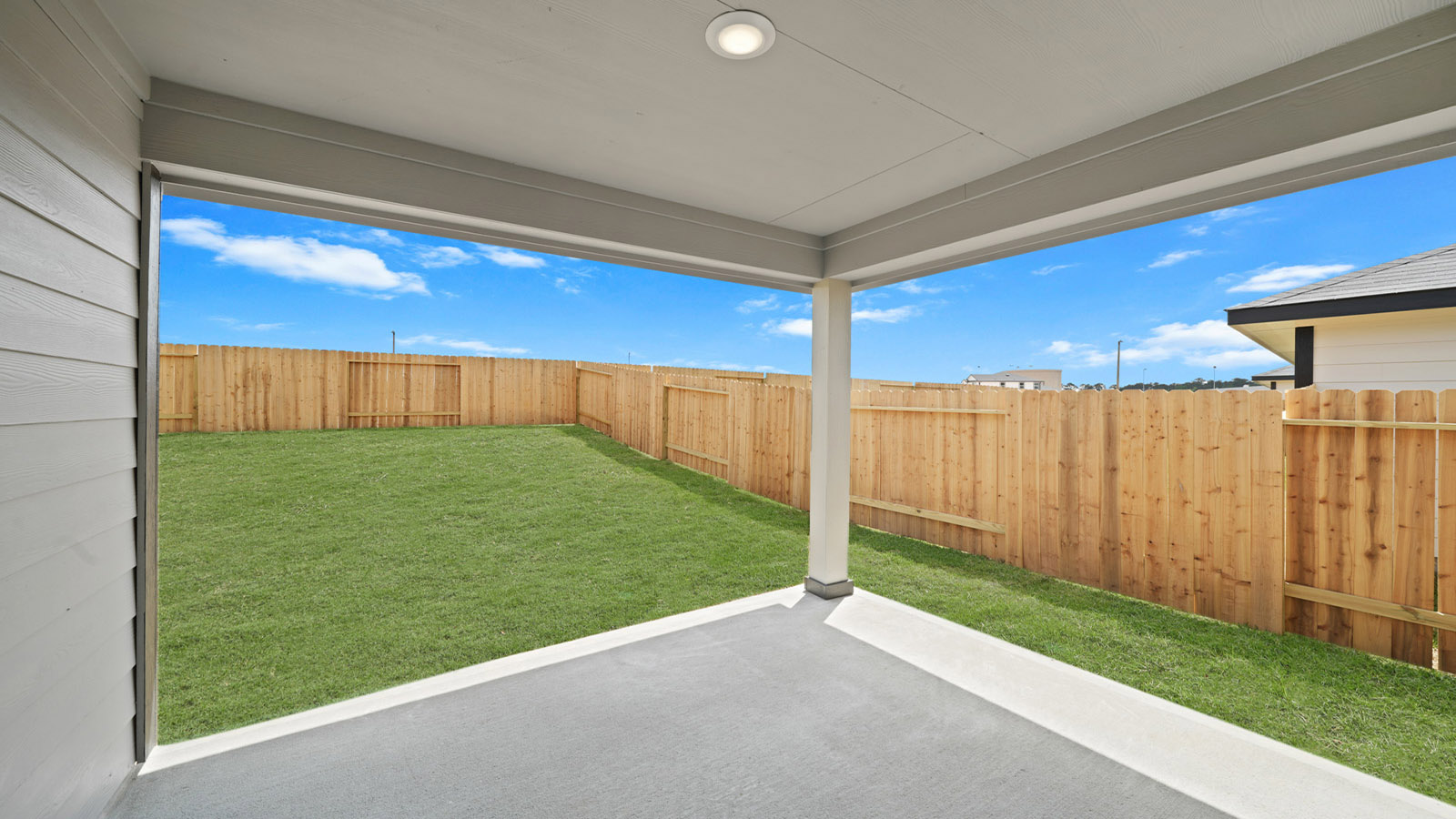 covered patio with overhead lighting