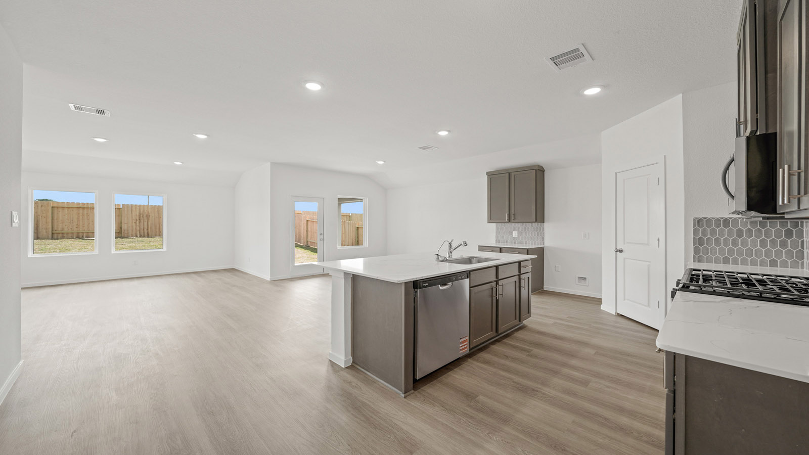 Kitchen with an island and vinyl floor