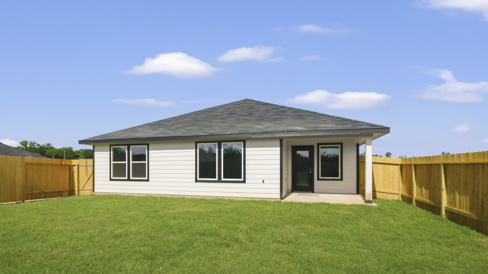 back of house with james hardie siding and glass back door