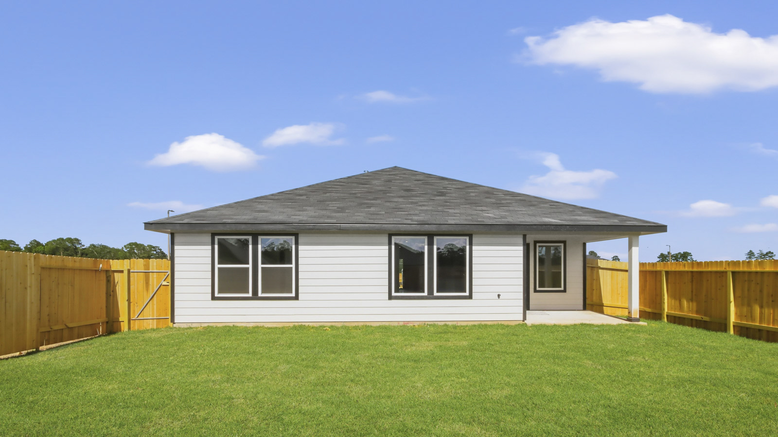 back of house with james hardie siding and glass back door