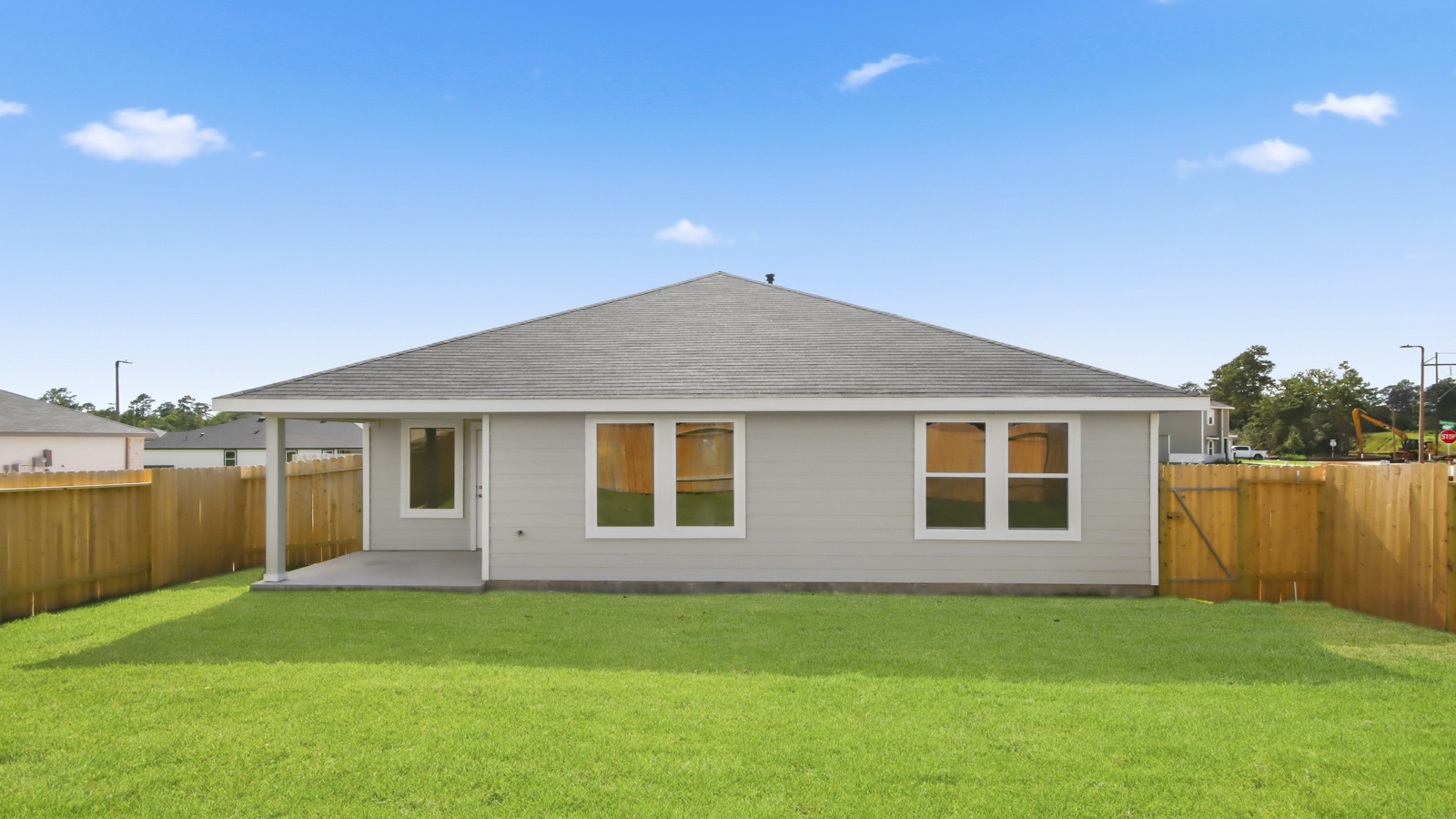 back of house with james hardie siding and glass back door