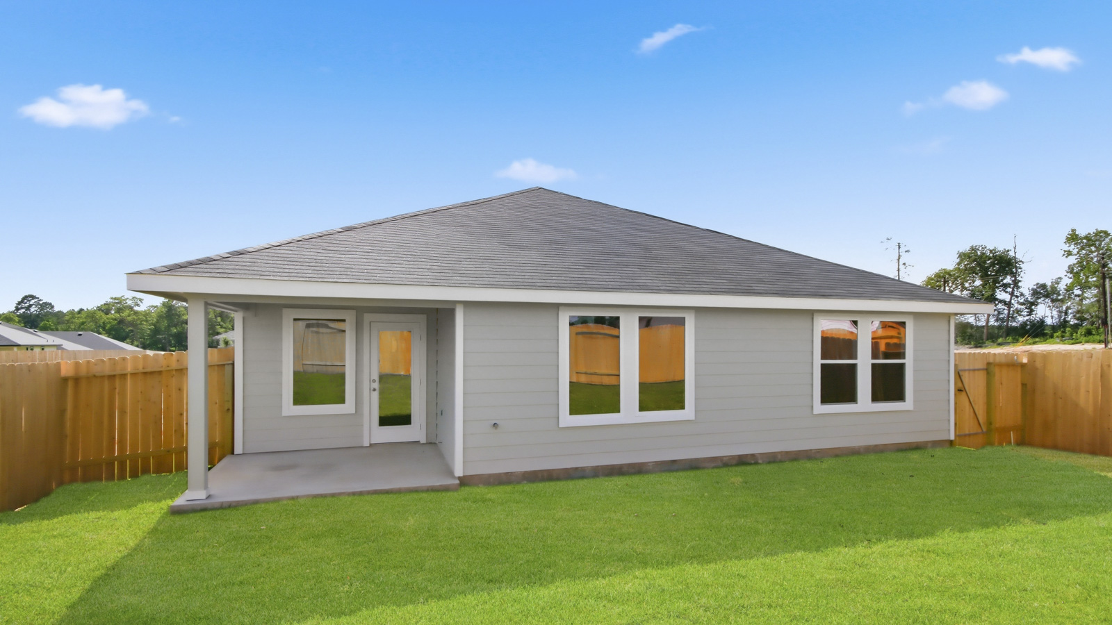 back of house with james hardie siding and glass back door