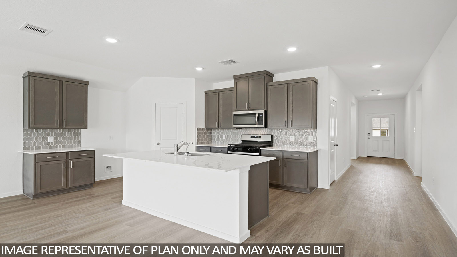 Kitchen with an island and vinyl floor
