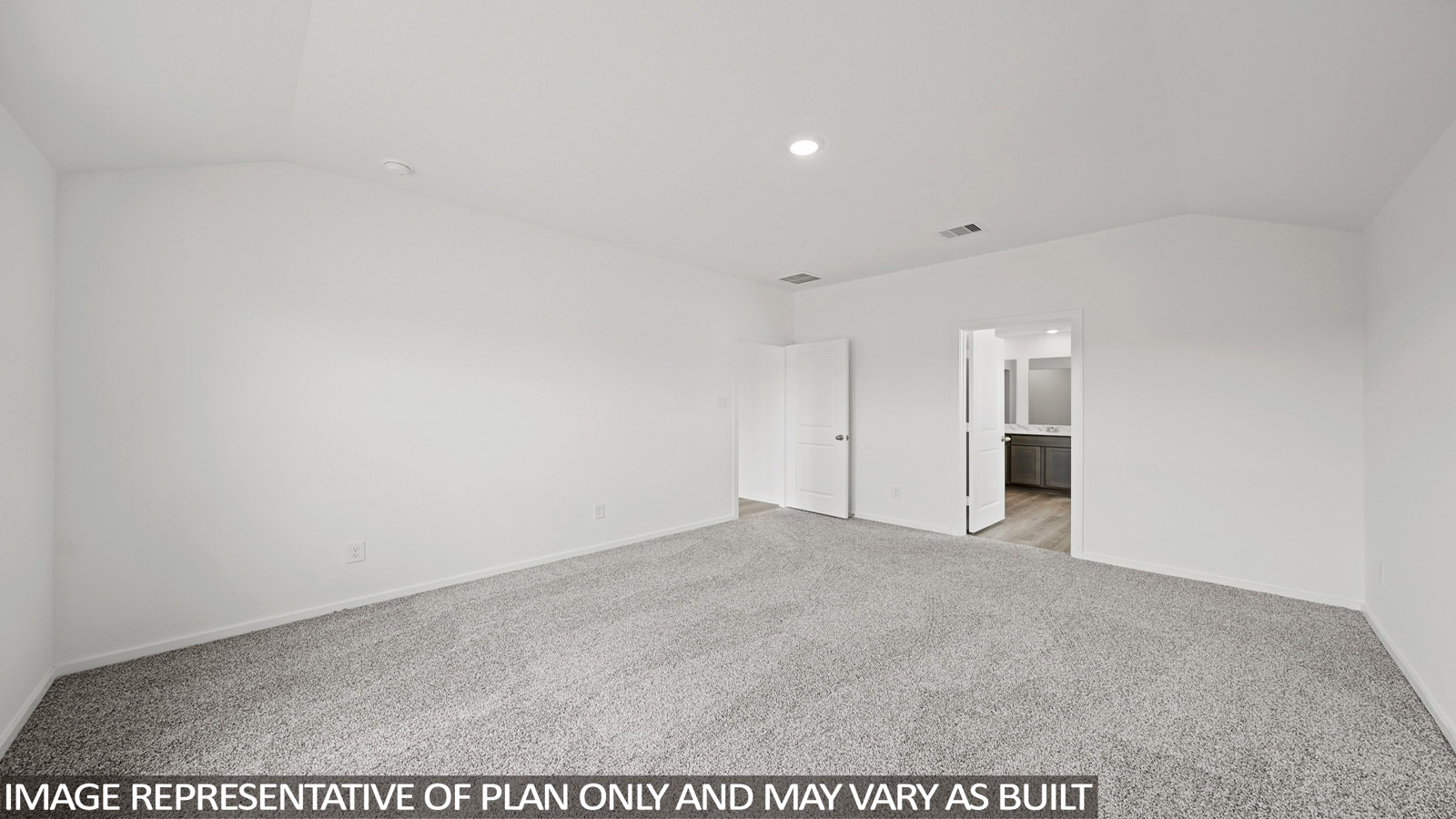 Primary bedroom with carpet flooring