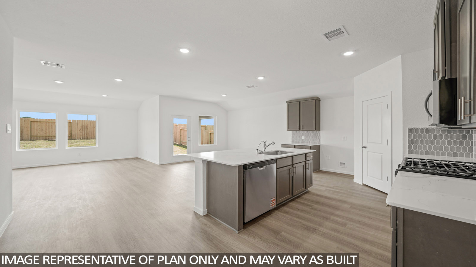 Kitchen with an island and vinyl floor