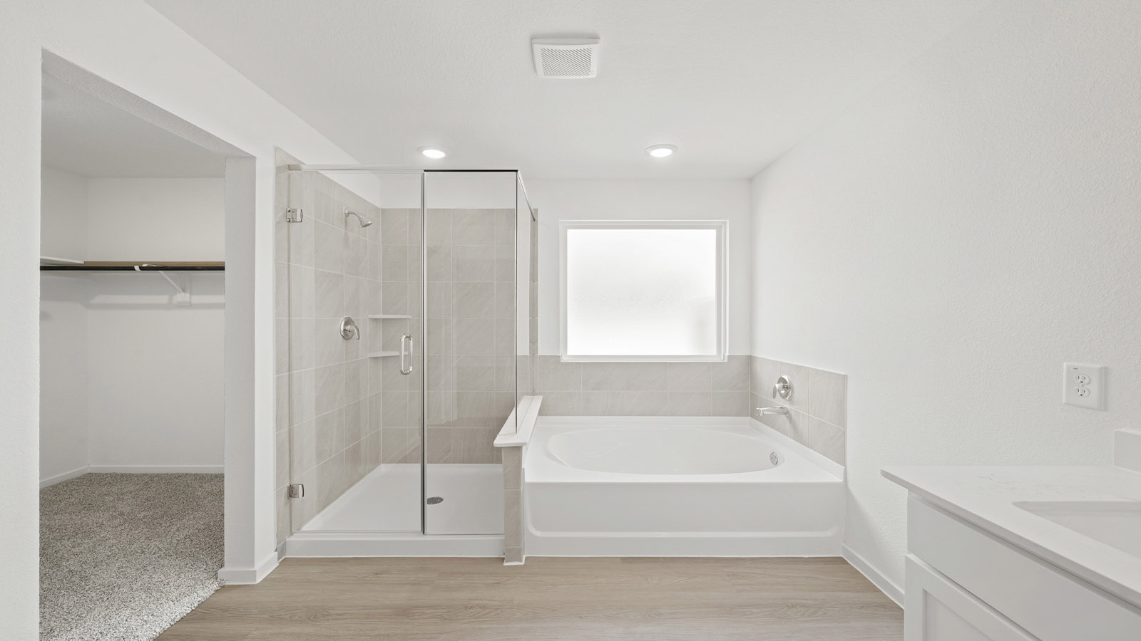Primary bathroom with tub and shower