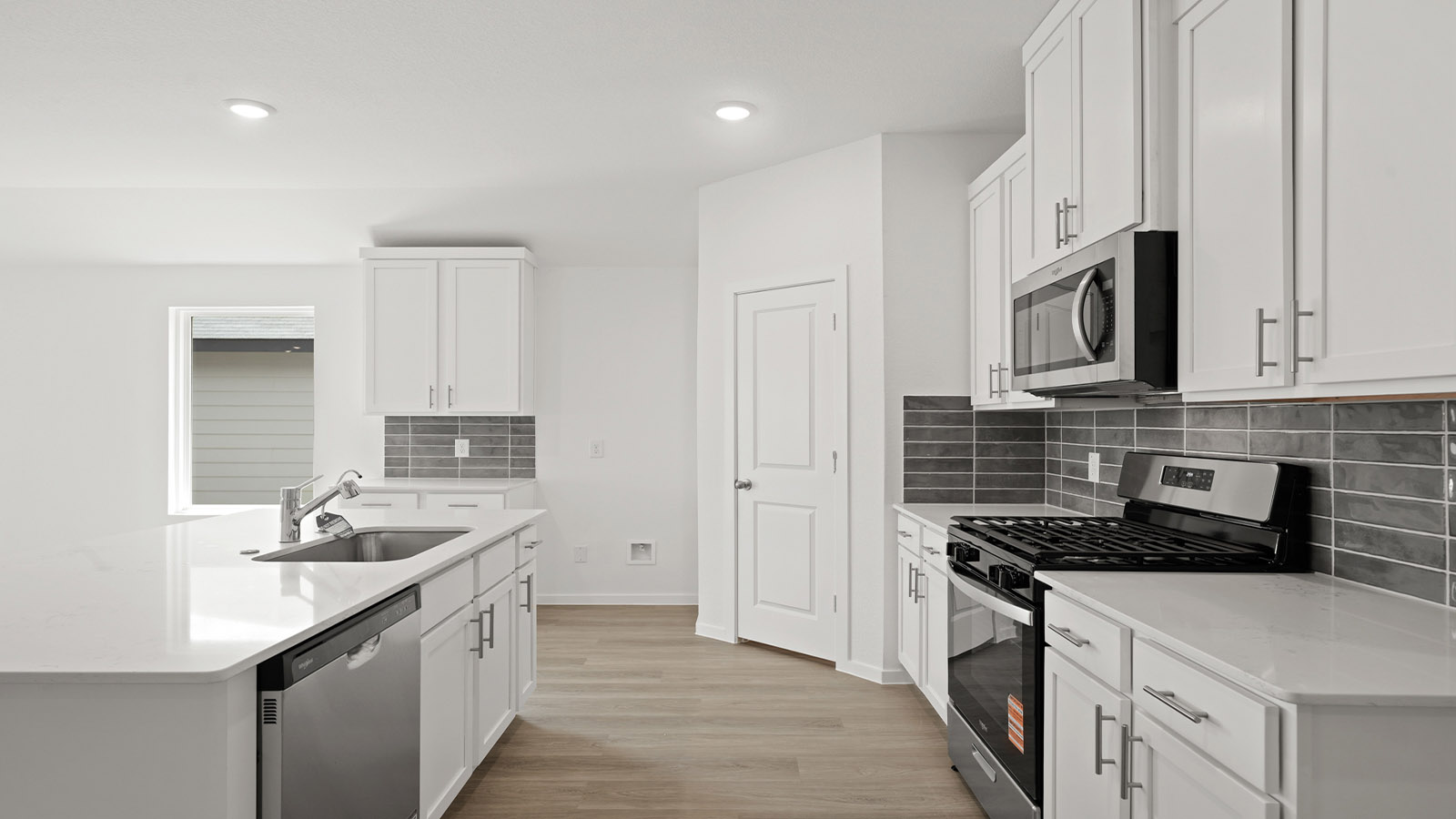 Kitchen with an island and vinyl floor