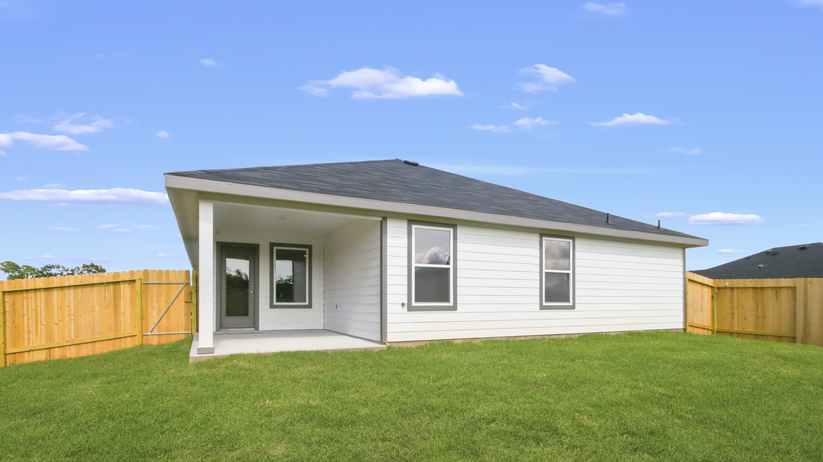 covered patio with jamies hardie siding and overhead lighting
