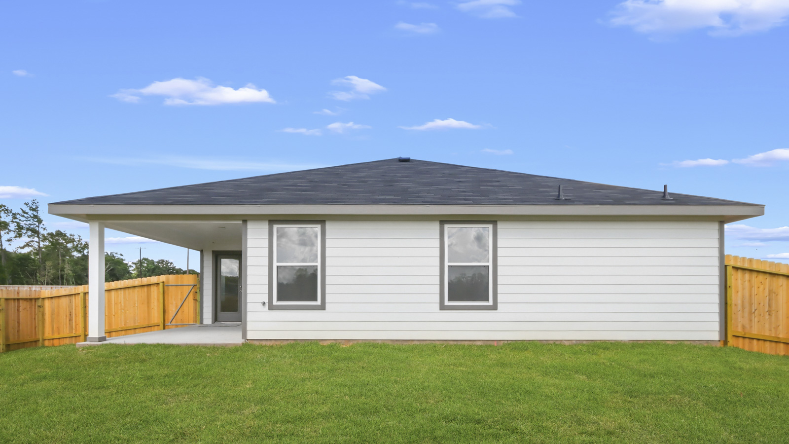 covered patio with jamies hardie siding and overhead lighting