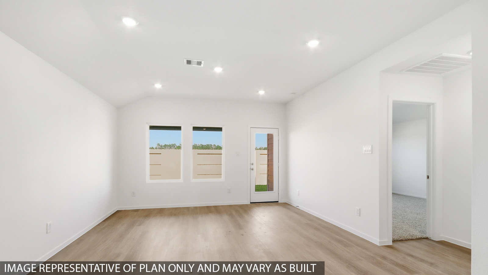 Spacious living area with vinyl flooring and bright windows in Hockley TX