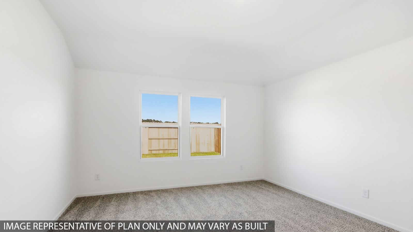 Large Primary bedroom with shag carpet flooring and bright window