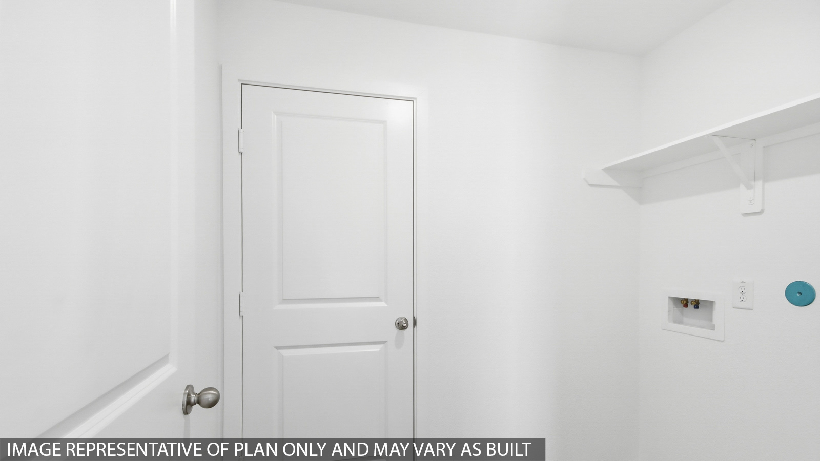 Utility room with storage located off the entry hallway and garage door