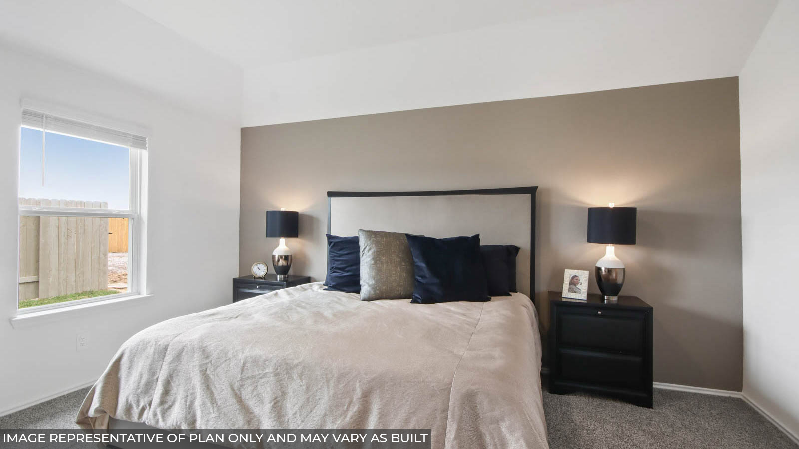 primary bedroom with carpet flooring