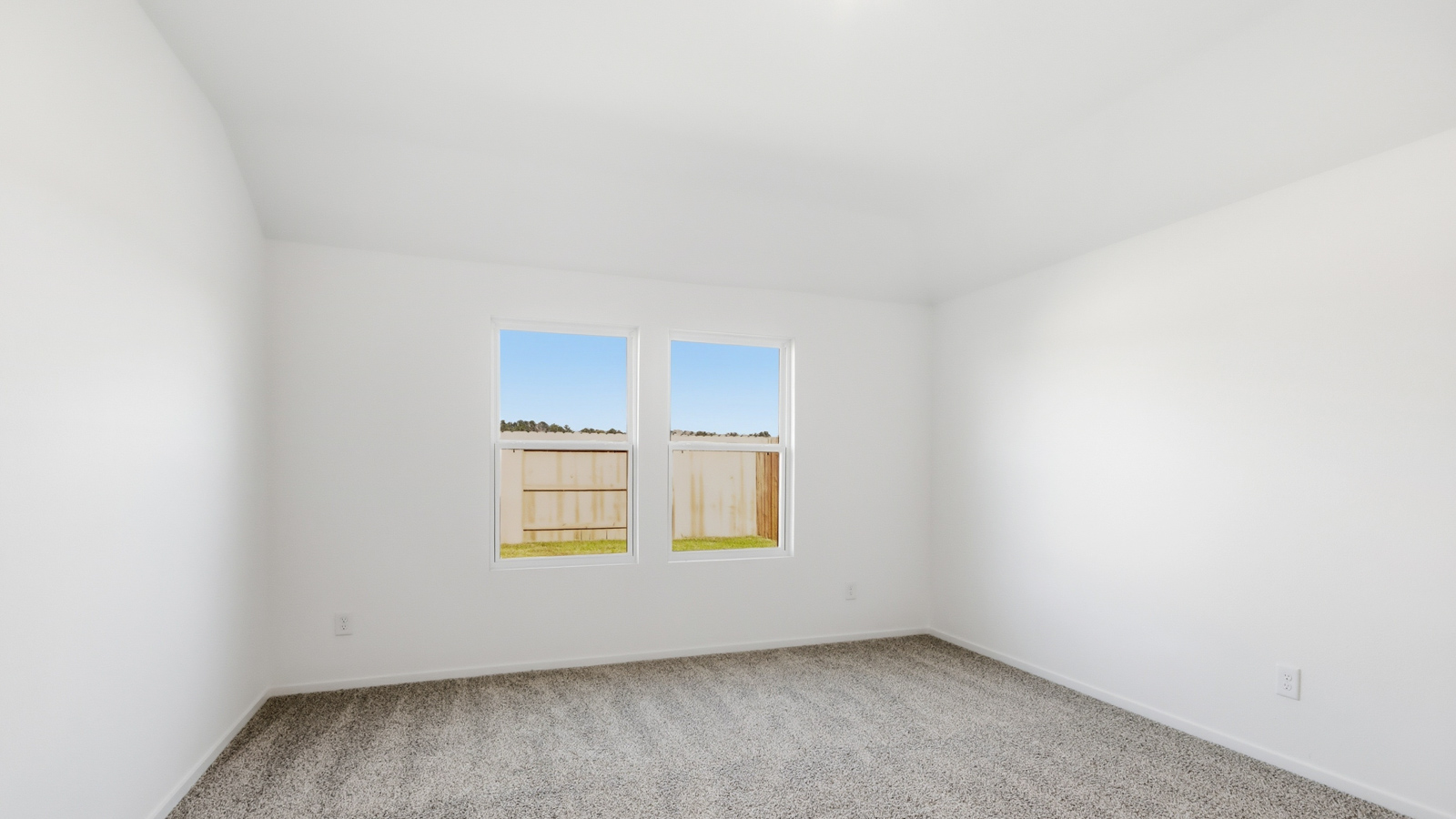 primary bedroom with carpet flooring