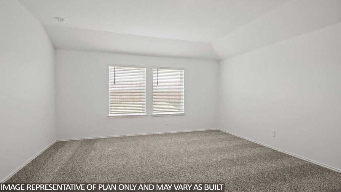 open concept livving and dining area with vinyl flooring, quartz countertops, and large windows in Hockley, TX